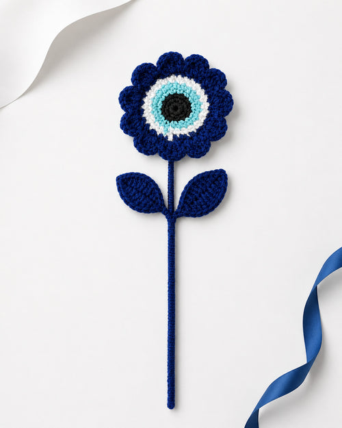 Handmade blue crochet evil eye flower stem by Kreatknit
