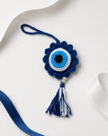 Handmade blue crochet evil eye tassel charm by Kreatknit