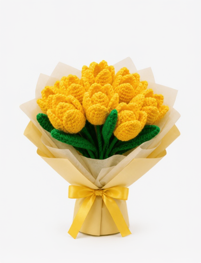 Crochet knitted yellow tulip bouquet with green leaves and a yellow ribbon on a white background